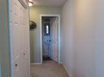 Hallway upstairs with washer and dryer in closet